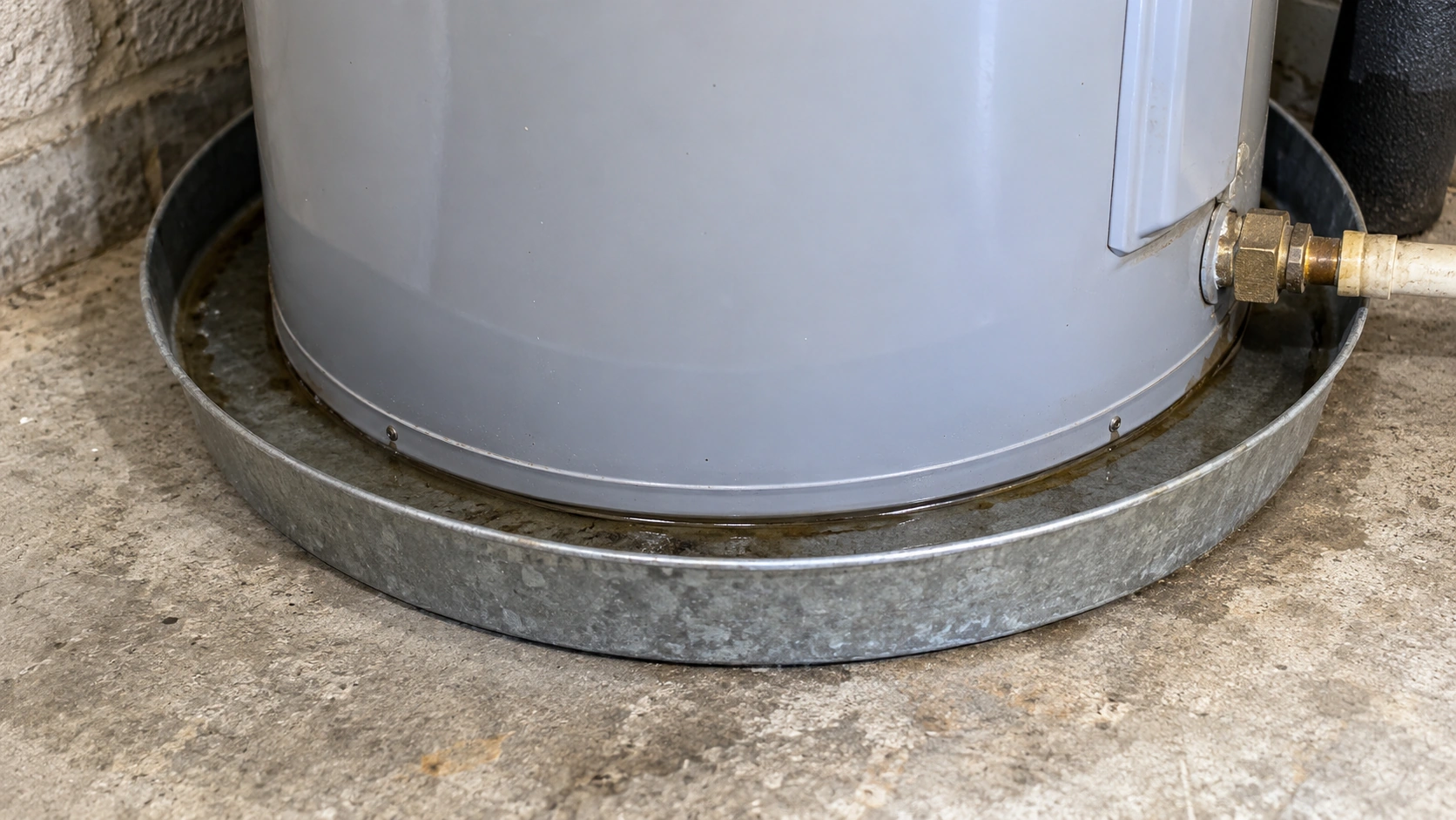 A thin wet ring in a water heater pan.