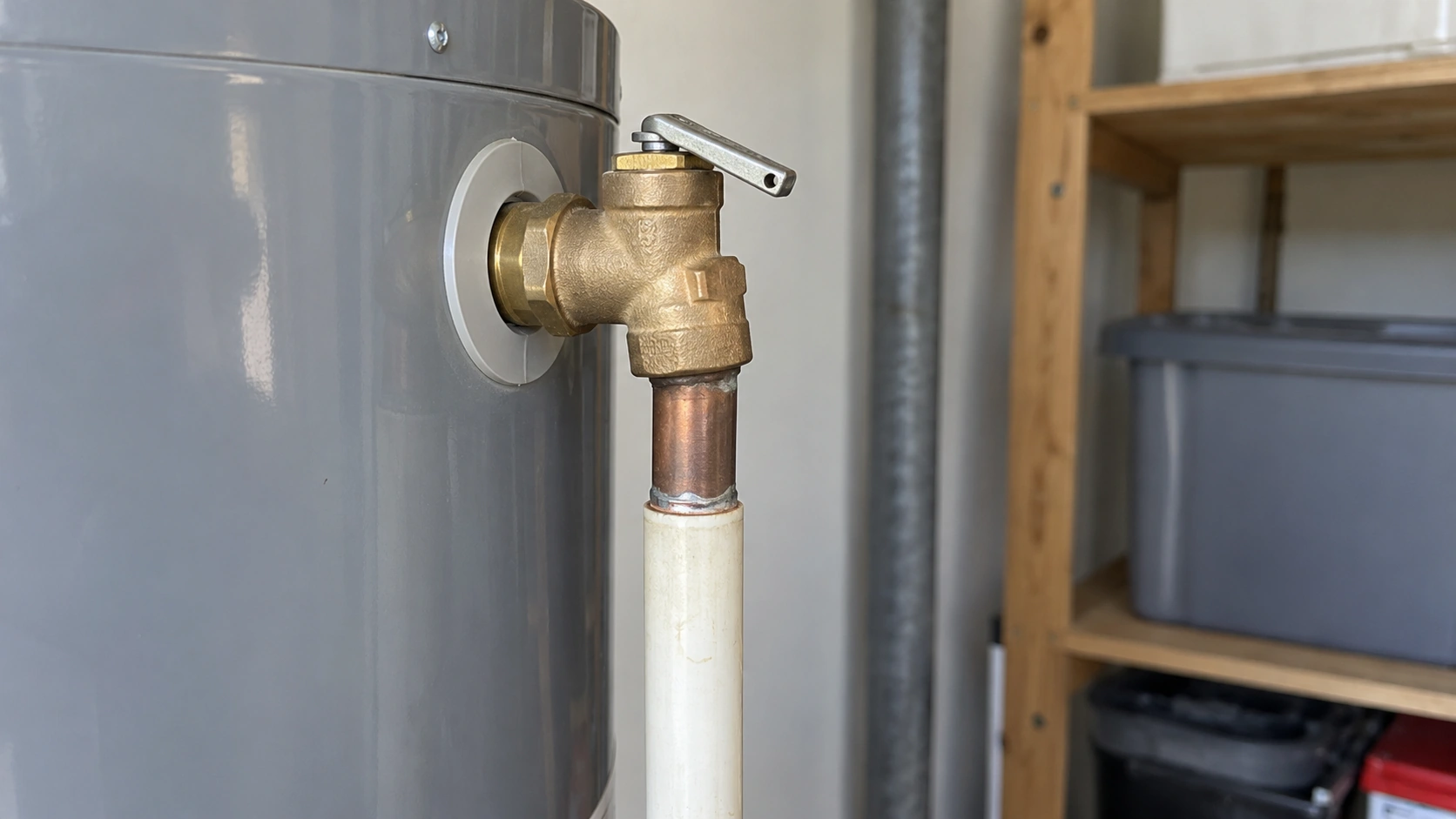 A water heater relief valve and discharge pipe.
