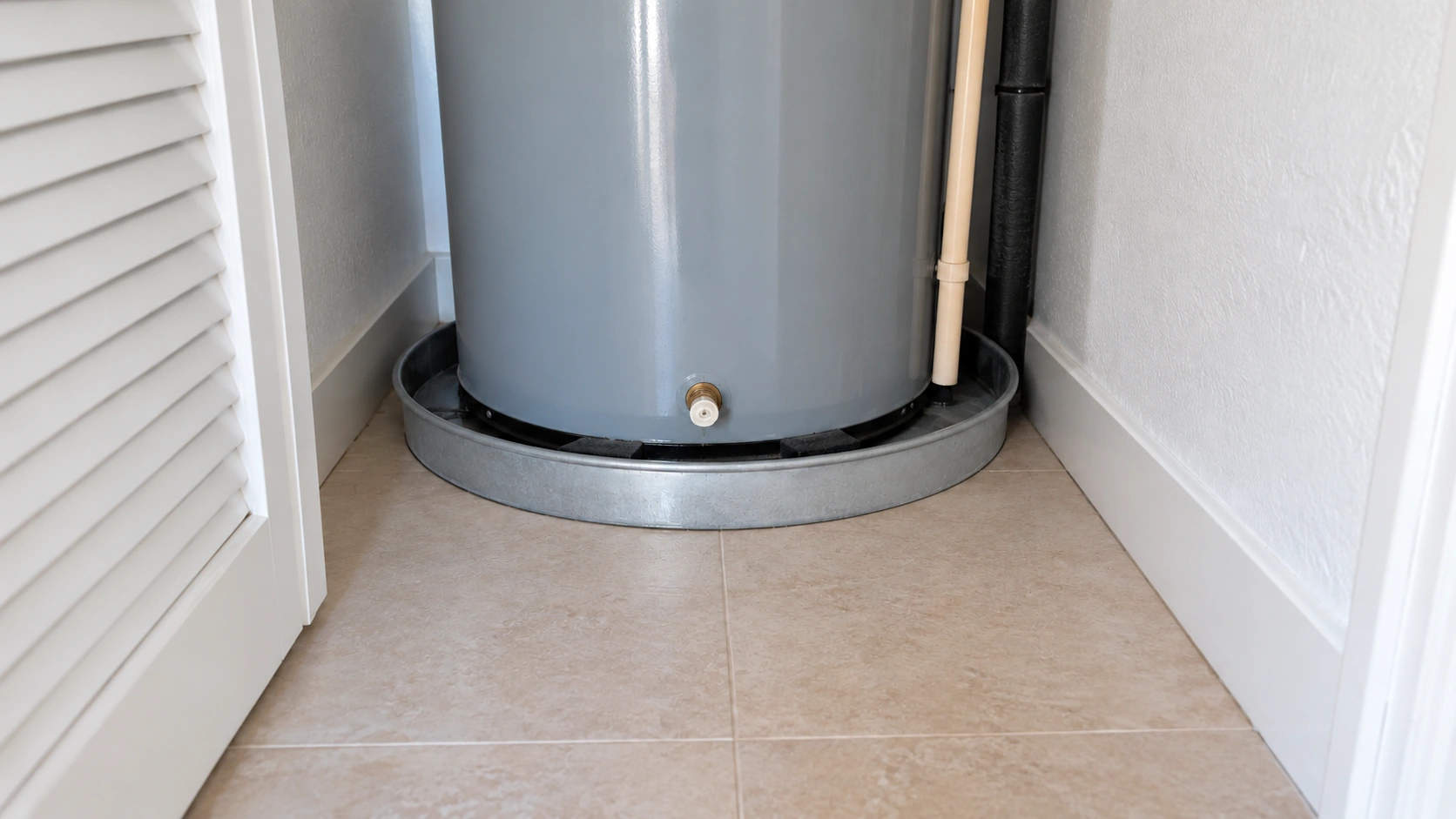 The same closet with a dry pan and the heater sitting quiet.